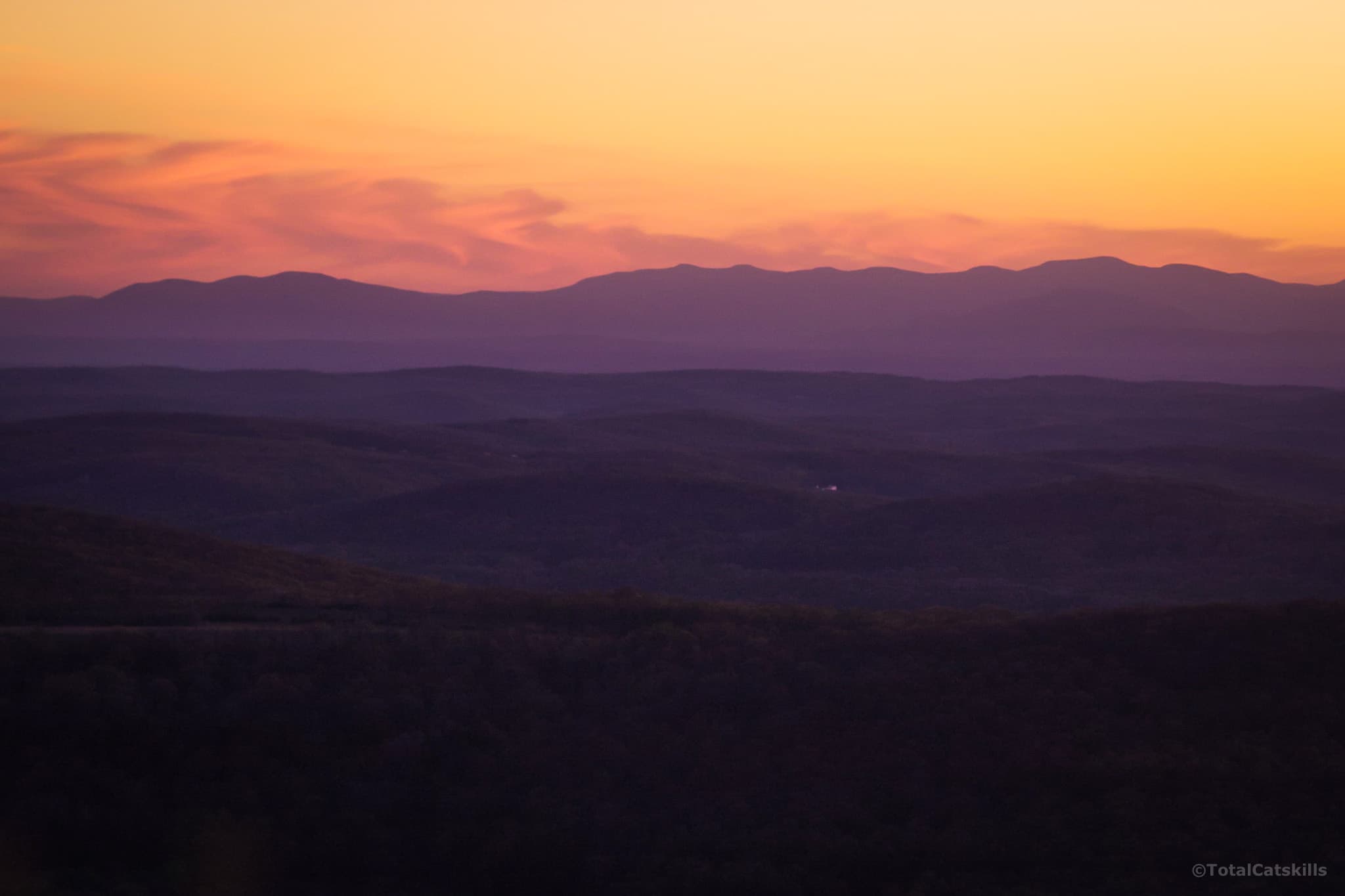 mountain range in distance at sunset