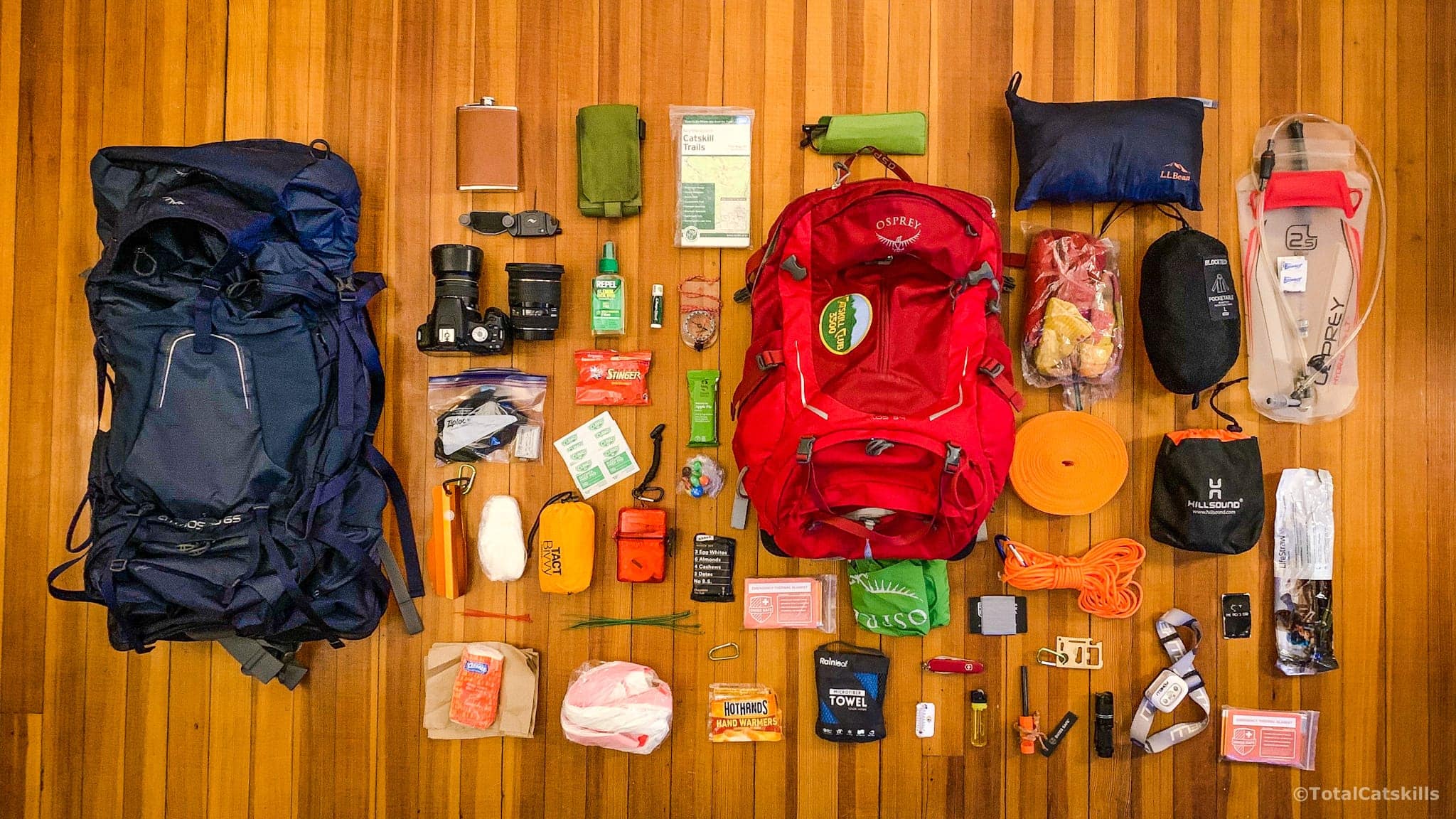 hike essentials and two backpacks