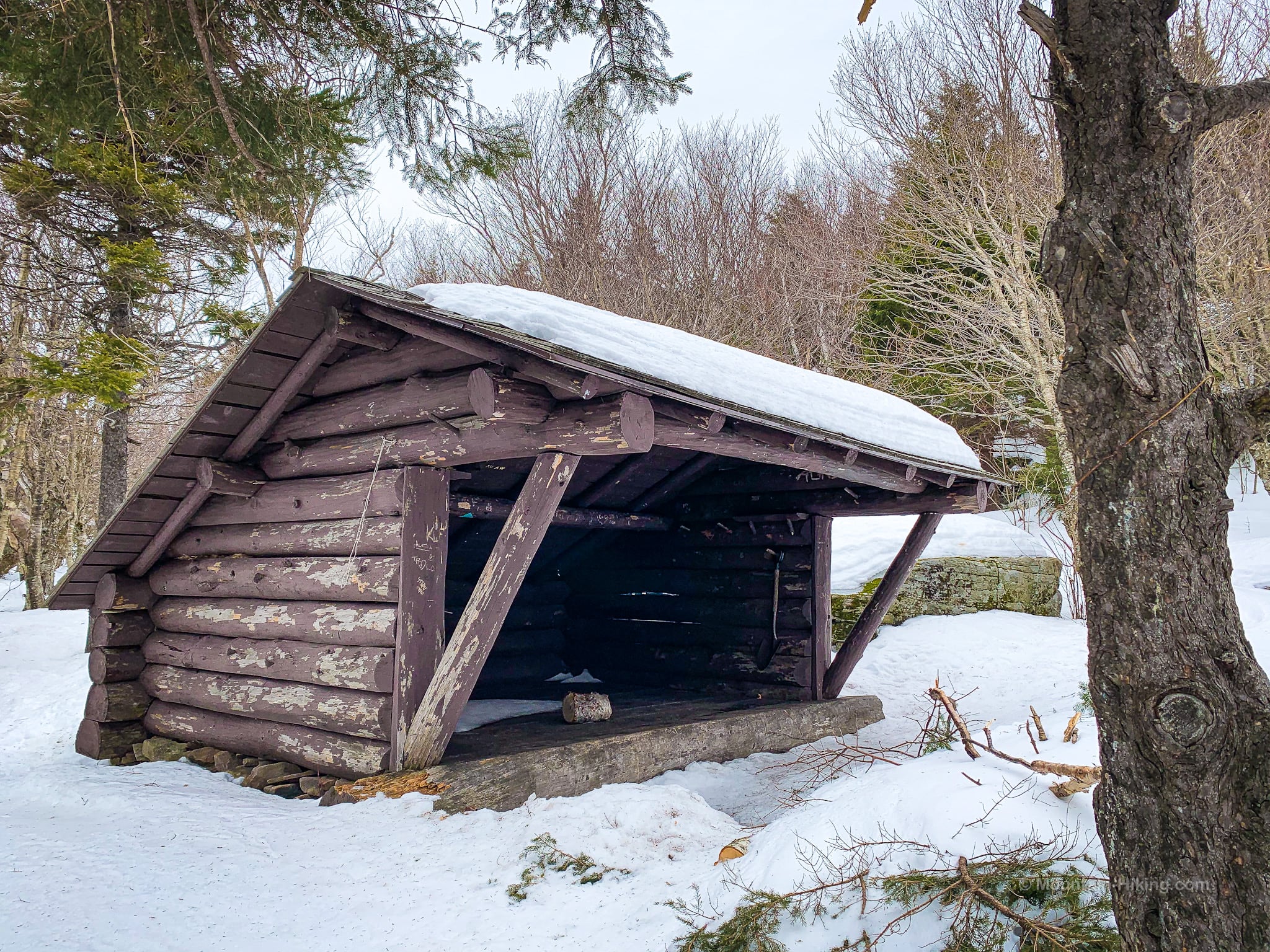Wooden lean-to in deep snow
