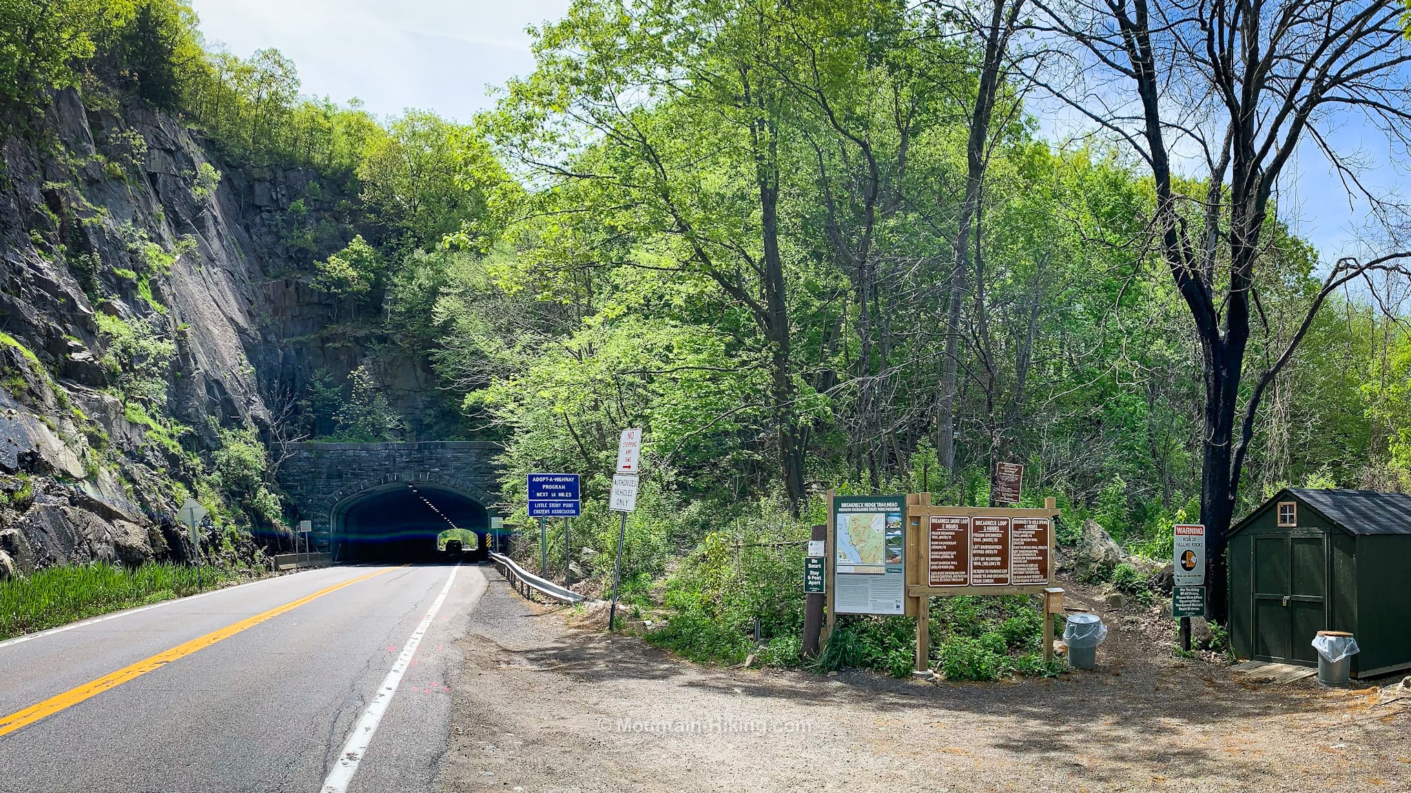 Breakneck Ridge trailhead next to road and tunnel
