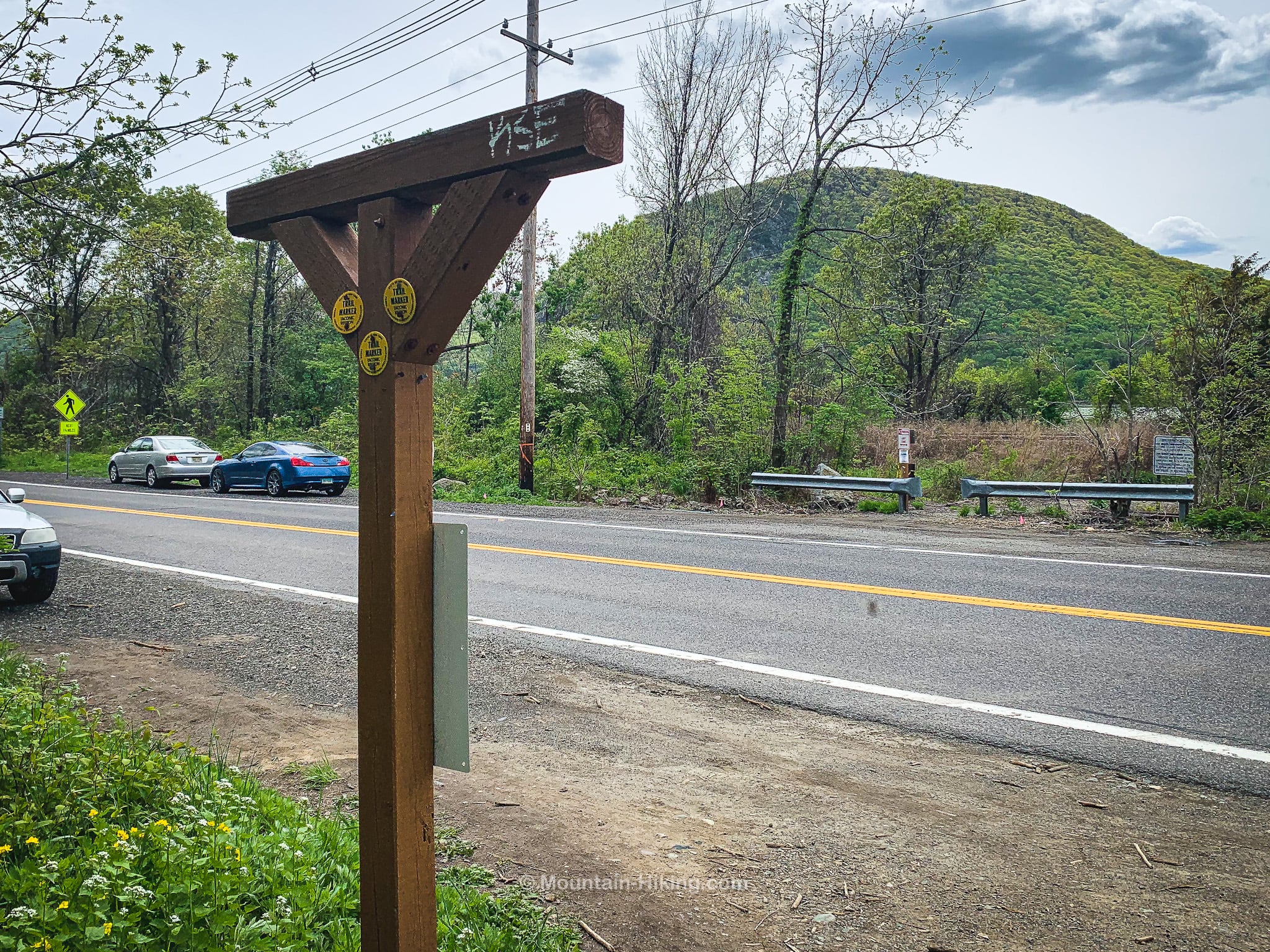 trailhead signpost at road side
