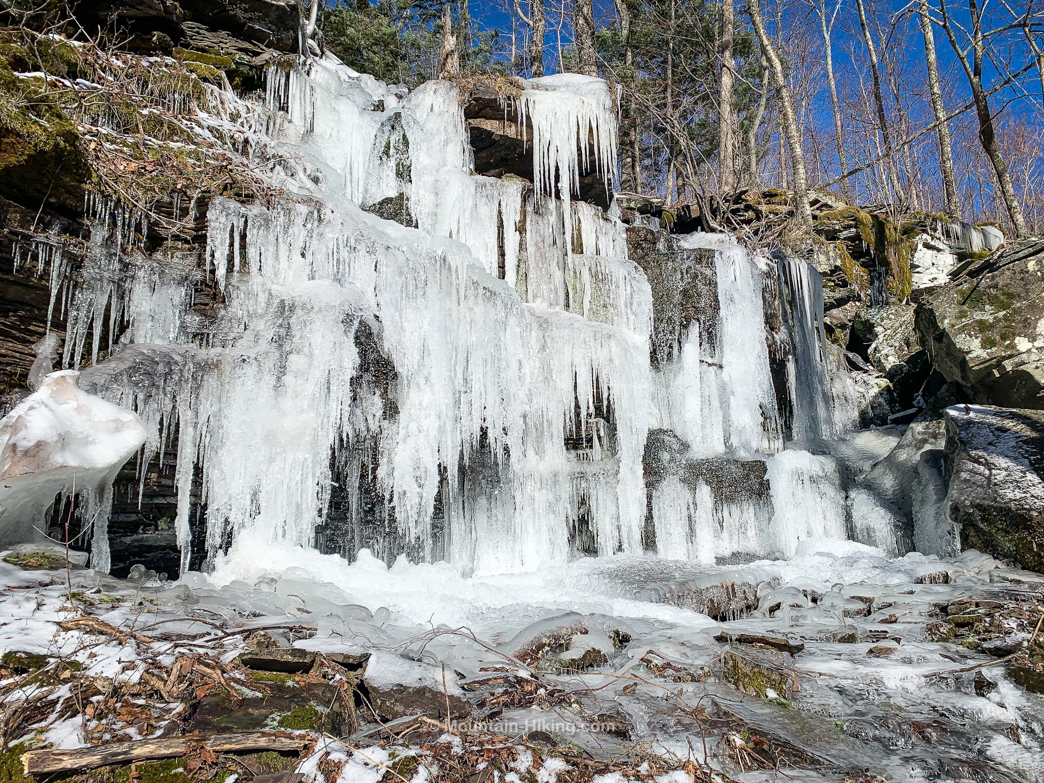 icicles hanging from rock wall