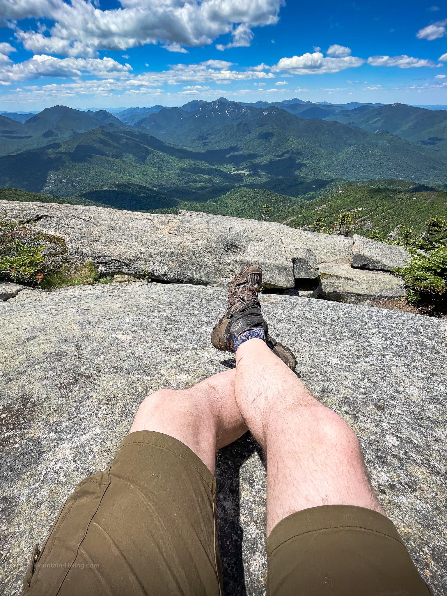 hiking shorts on hiker on mountain summit