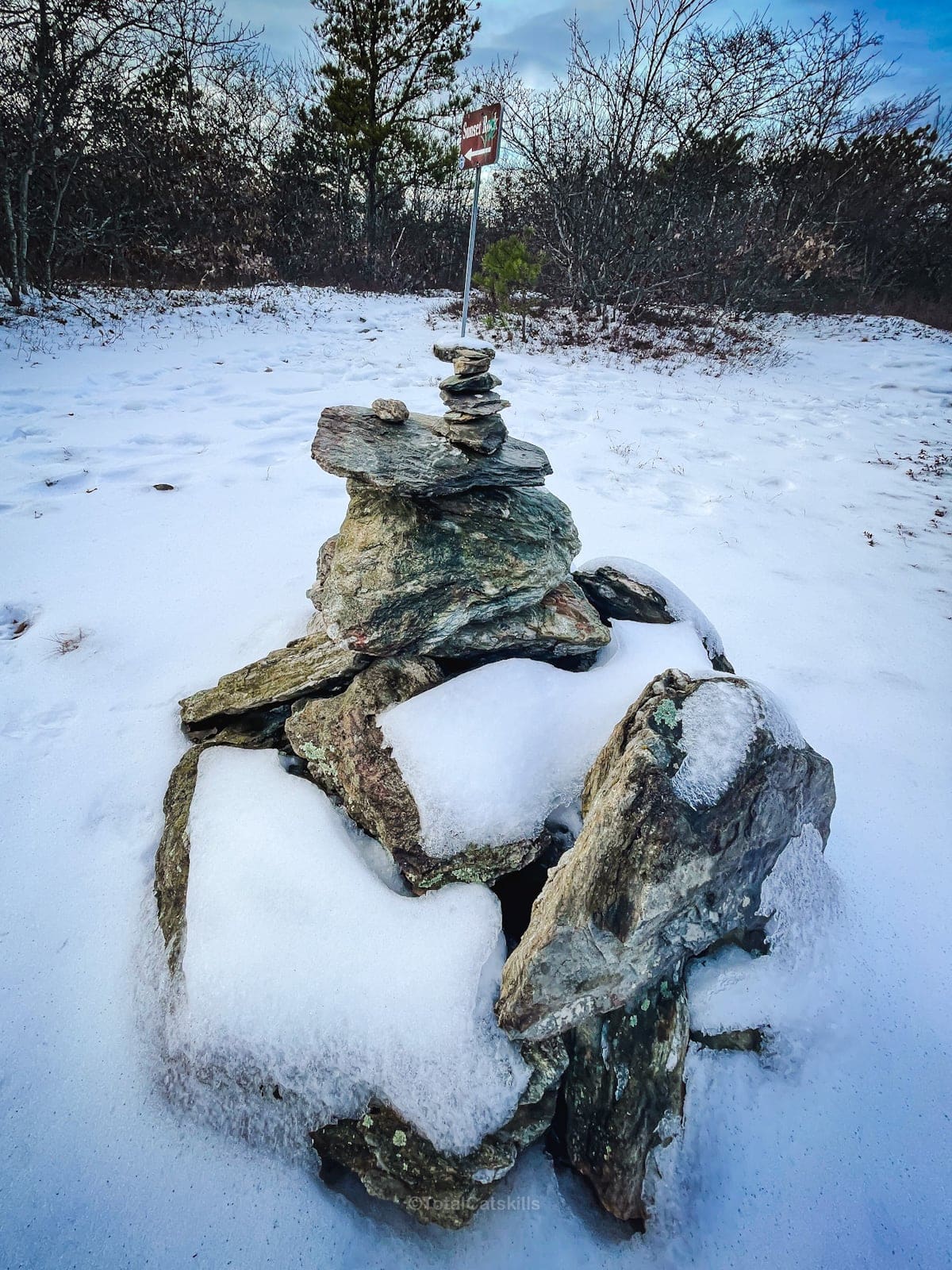 rock cairn in snow